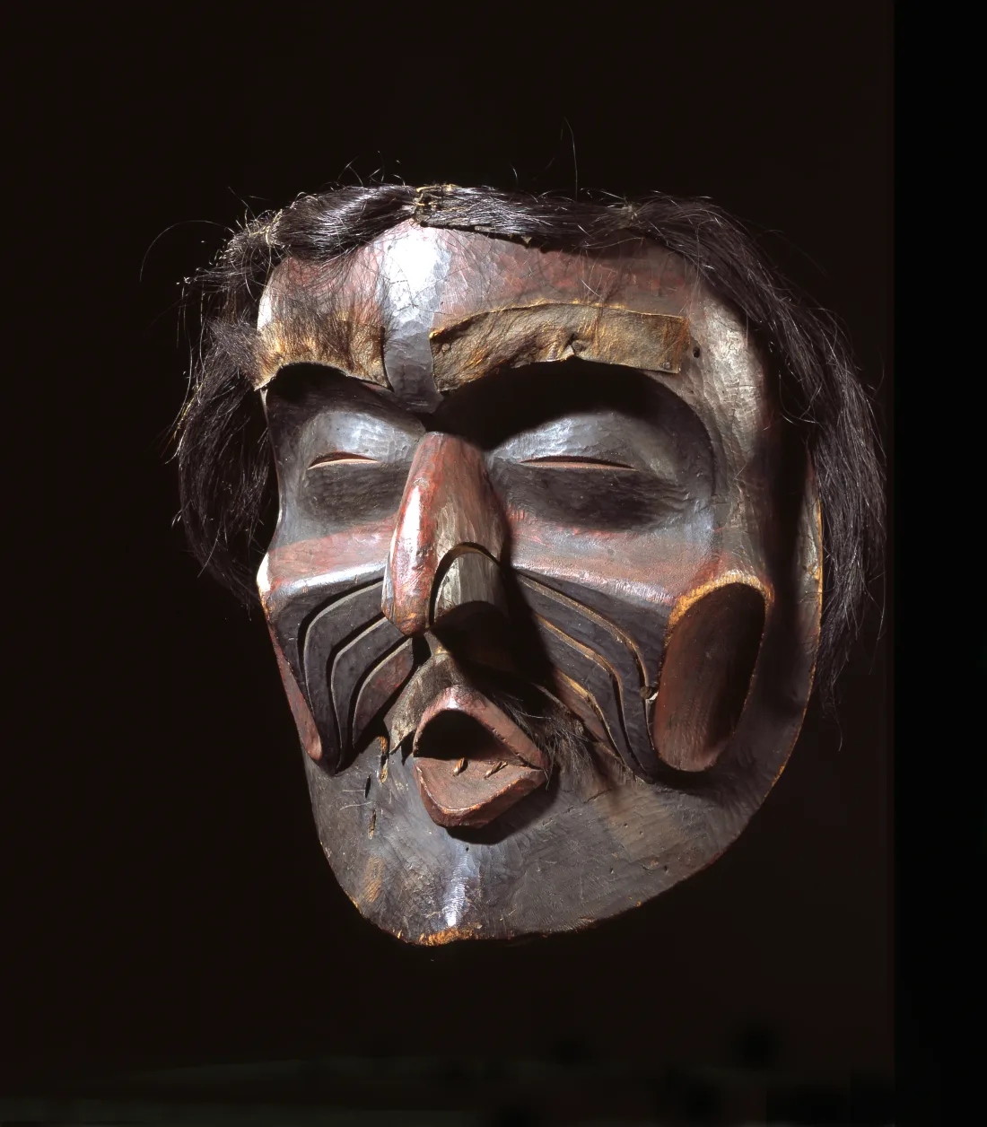 Mask made of painted cedar wood