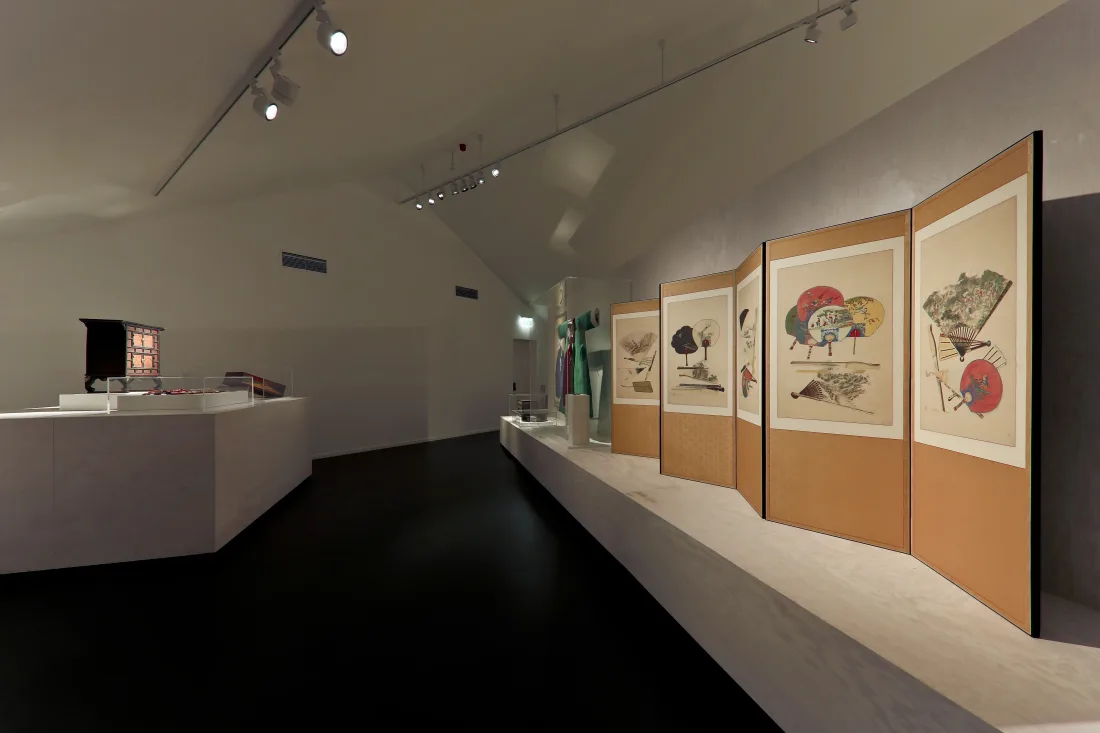 View of the exhibition, depicting folding screen with fans