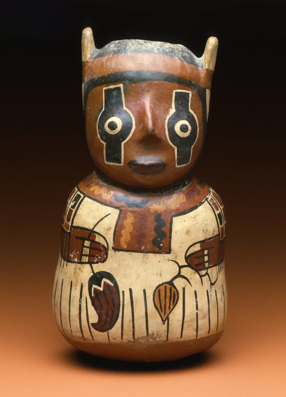 Vessel made of painted and fired clay, depicting a human figure with painted eyes and holding field crops