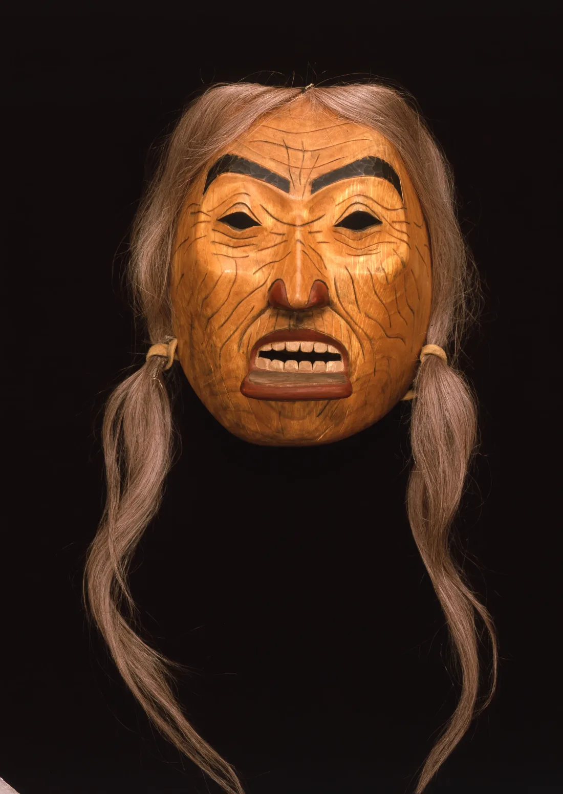 Mask of an old woman with lip adornment and hair, Canada