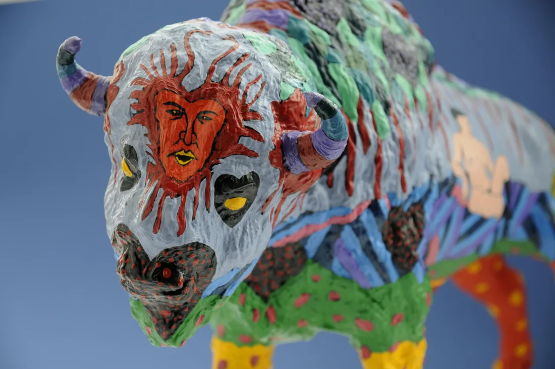 Colourfully painted plastic buffalo