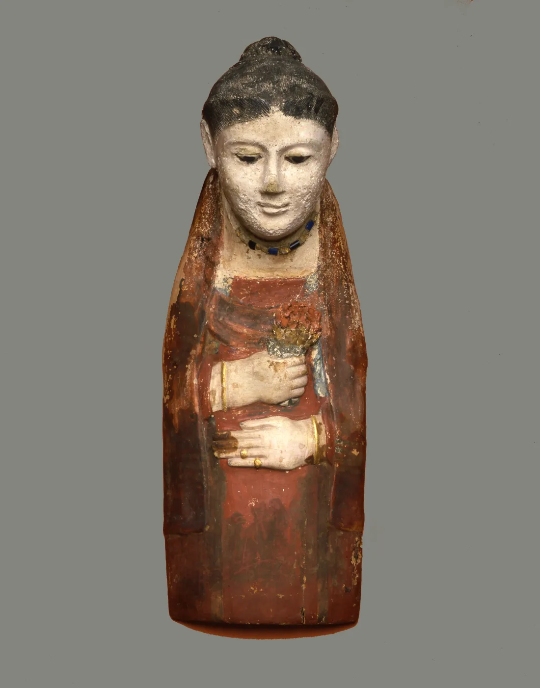 Mummy mask of a woman, made of limestone and plaster