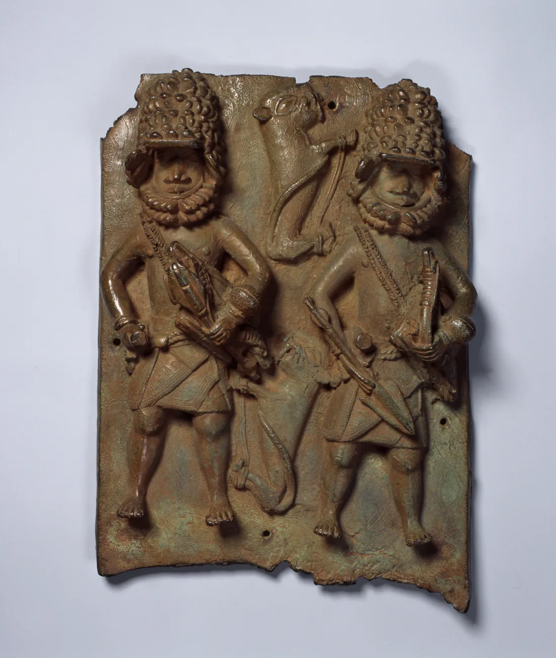 Relief plate with two leopard hunters with equipment