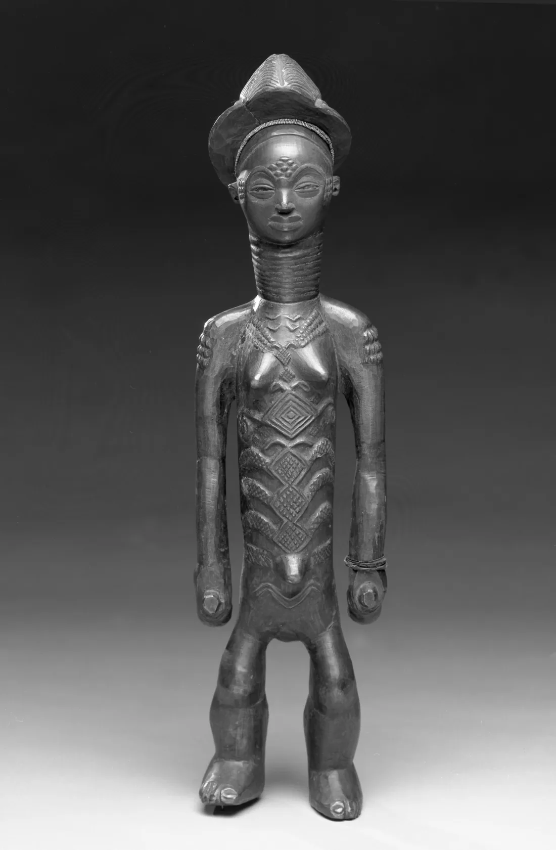 Female figure carved from wood